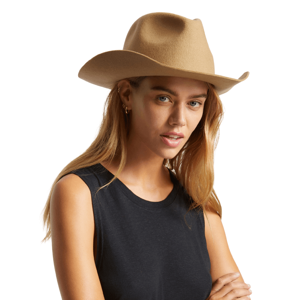 Person with long hair wearingAngle view of timber wold coloured Brixton Duke Cowboy Hat.