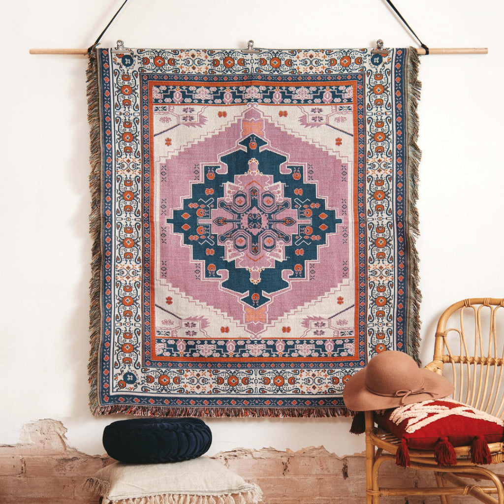 Hendeer Strawberry Fields picnic rug hanging on wall.